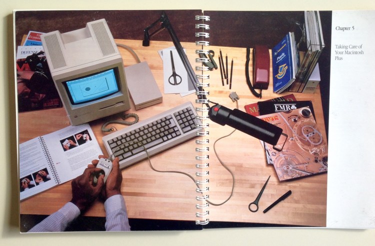 Photo of Chapter 5 opener (a two-page photo of a man removing a mouse ball from a Mac Plus)
