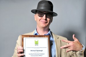 Michael Opsteegh poses with his plaque
