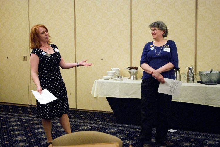 Photograph of Emily Alfson, left, and Nancy Allison, STC New England Council volunteers, at InterChange regional conference, April 2016