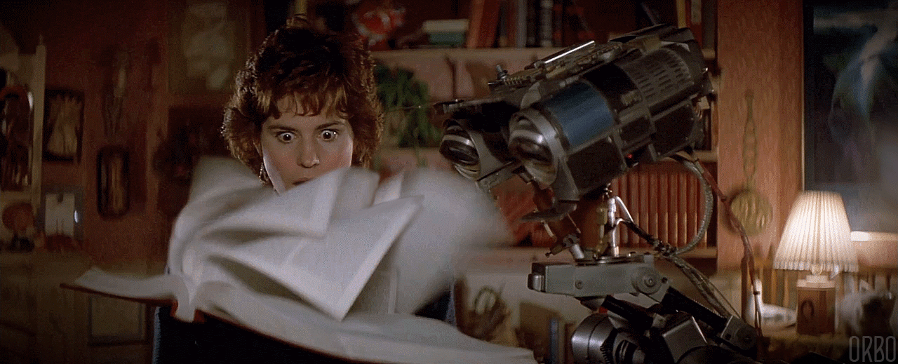 In this image from "Short Circuit," the robot Johnny Five is scanning a book with incredible speed